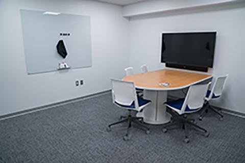 Features: 5 chairs, table, video conference technology with HDMI and USB cables, 3 whiteboards with dry erase markers.